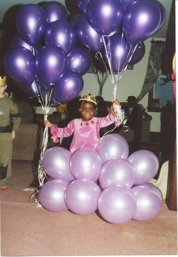 Lots of Balloons make a happy girl.