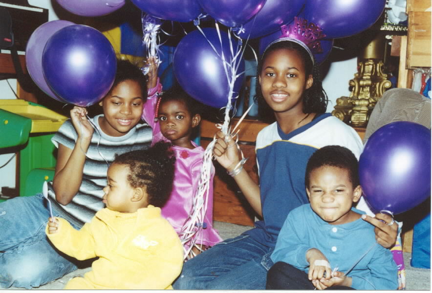 Cousins, niece and nephew help celebrate.
