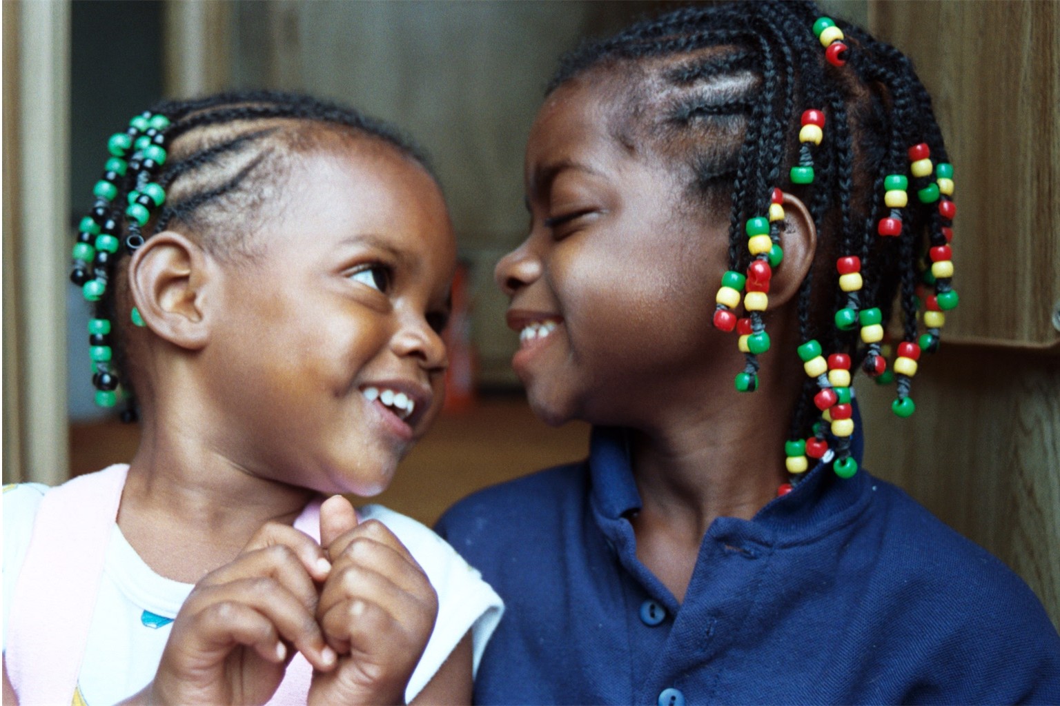 Fortune and Blessin happily sport their beads.