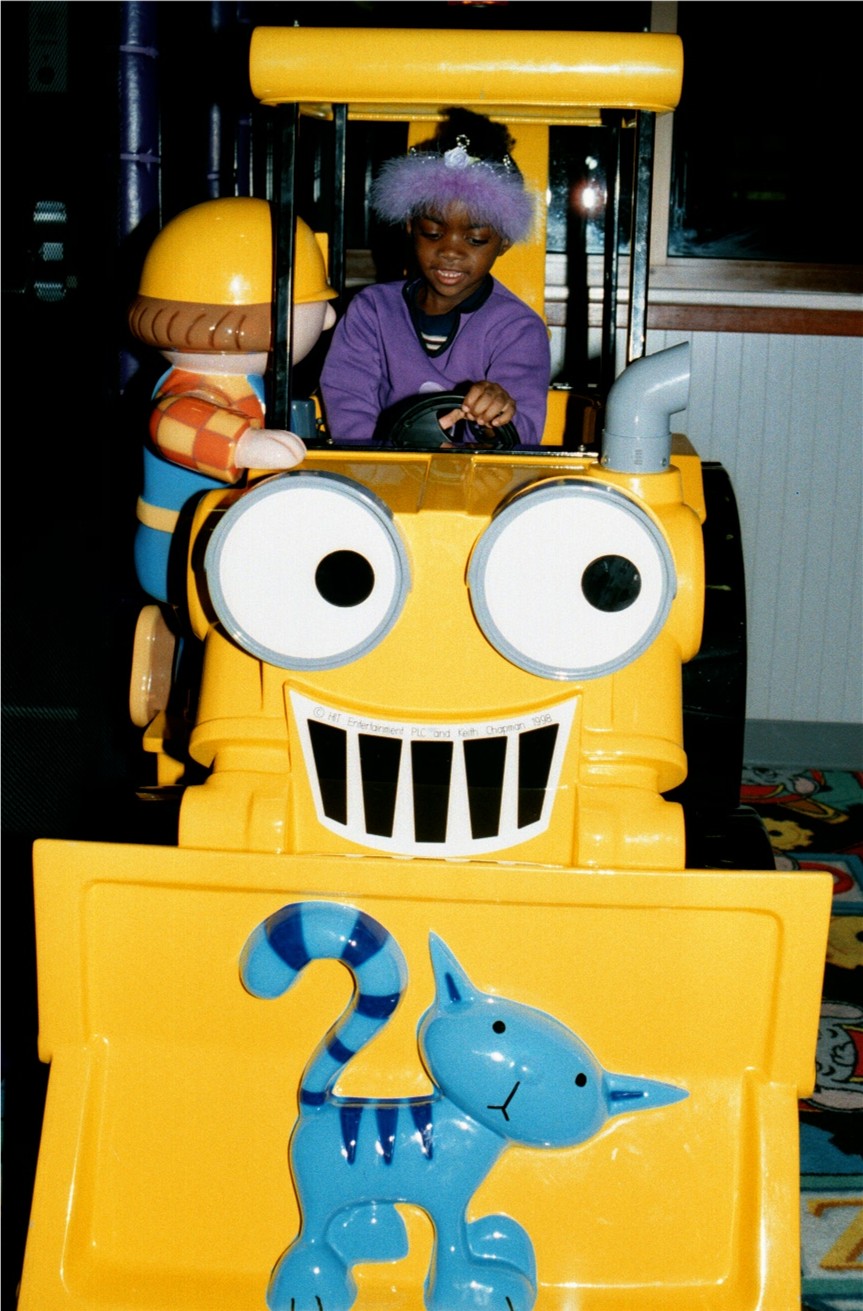 At Chuk E Cheeze Blessin rides the bulldozer.