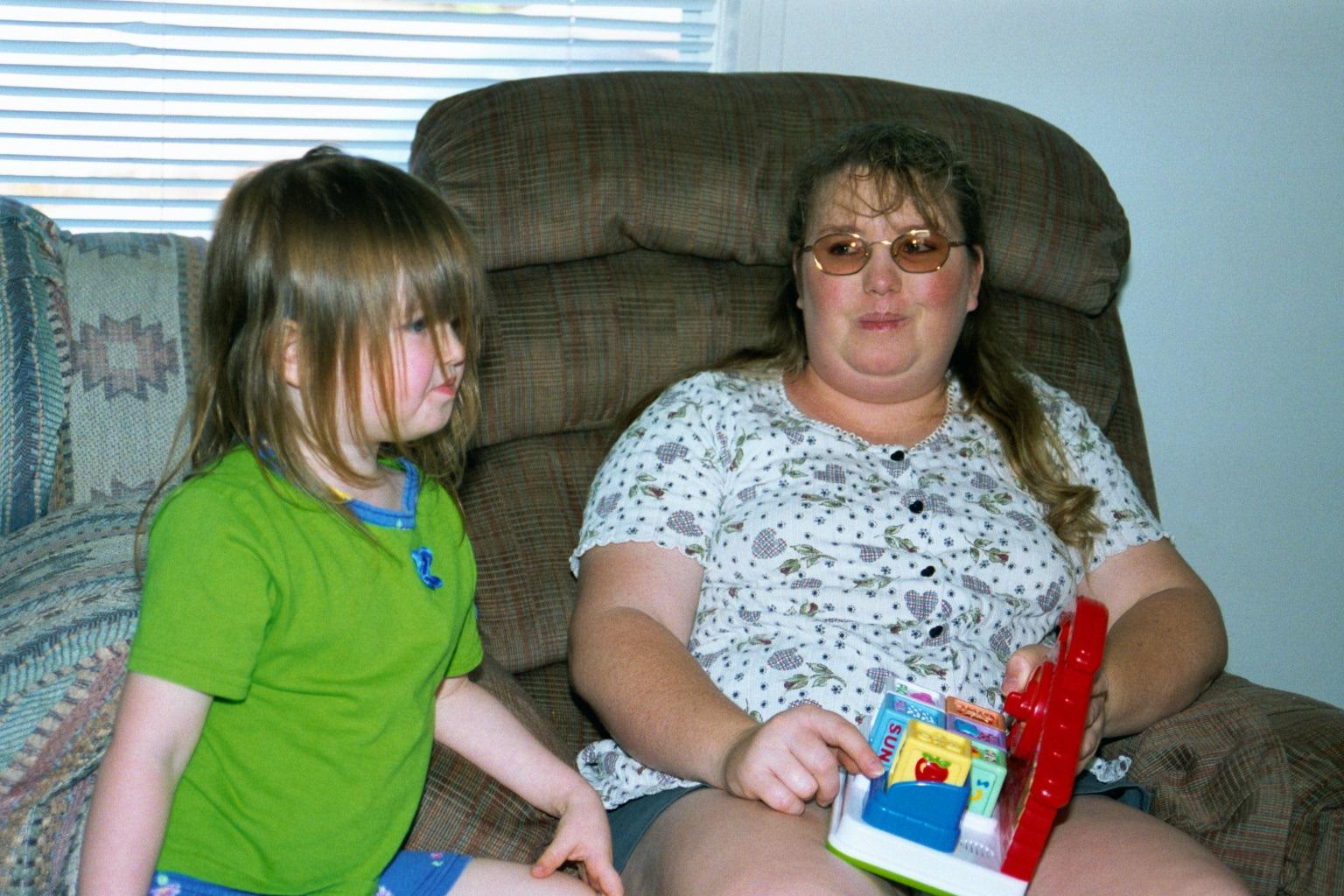 In Shannon's living room Shannon, Philana and Katelyn play too.